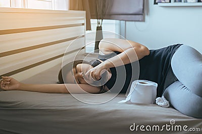 Woman have a morning sickness,Pregnant female nausea in bedroom Stock Photo