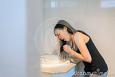Woman have a morning sickness,Pregnant female nausea in toilet Stock Photo