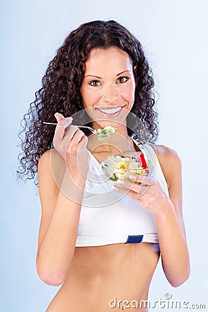 Woman have salad on fork Stock Photo