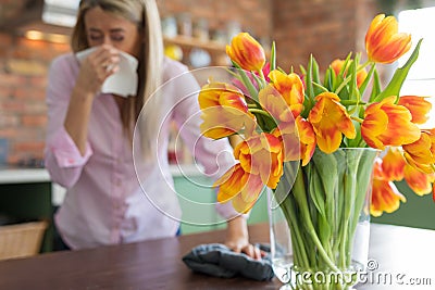 Woman having allergies to flowers Stock Photo