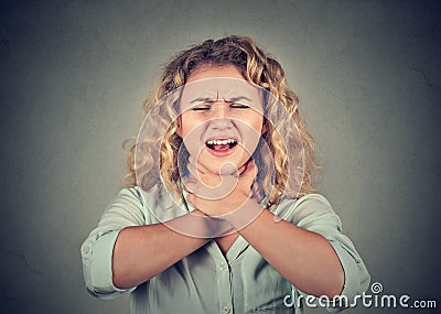 Woman having asthma attack or choking can't breath Stock Photo