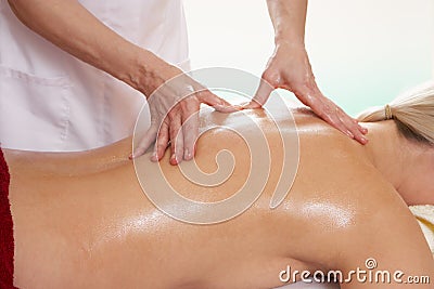 Woman having back massage Stock Photo