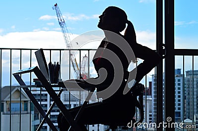 Woman having back pain while working at office desk Stock Photo