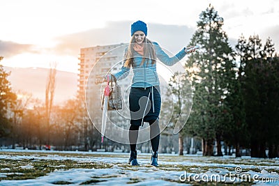 Woman having a city walk in thawing snow Stock Photo