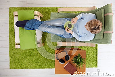 Woman having coffee at home Stock Photo