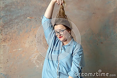 A woman is having despair and sadness and tearing her hair Stock Photo