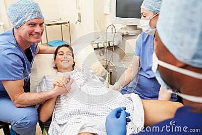 Woman Having Eggs Implanted As Part Of IVF Treatment Stock Photo