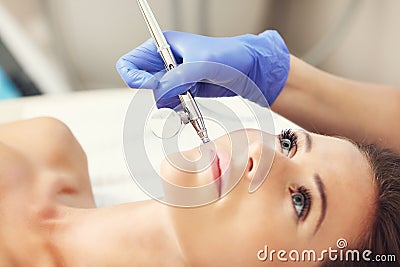 Woman having facial treatment in beauty salon Stock Photo