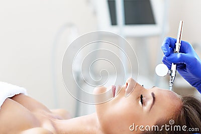 Woman having facial treatment in beauty salon Stock Photo