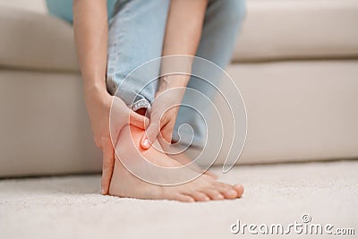 woman having leg pain due to Ankle Sprains or Achilles Tendonitis and Shin Splints ache. injuries, health and medical concept Stock Photo