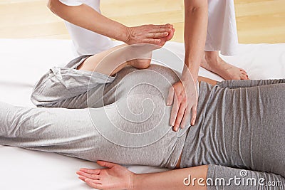 Woman having a lower back massage Stock Photo