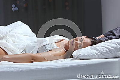 Woman having a nightmare in the bed in the night Stock Photo