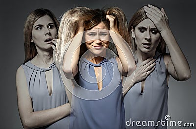 Woman having panic attack on grey background Stock Photo