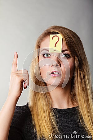 Woman having question mark on forehead Stock Photo