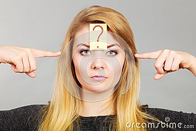 Woman having question mark on forehead Stock Photo