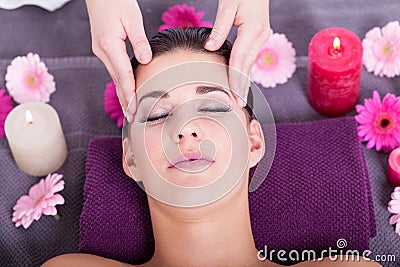 Woman having a relaxing facial massage Stock Photo