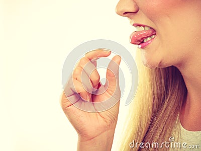 Woman having something disgusting on tongue Stock Photo