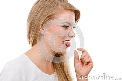 Woman having something disgusting on tongue Stock Photo