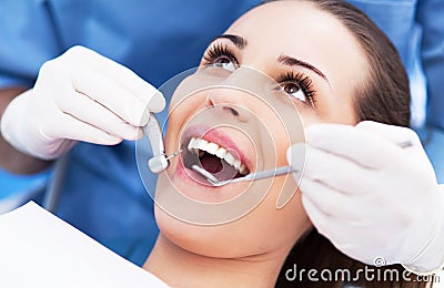 Woman having teeth examined at dentists Stock Photo