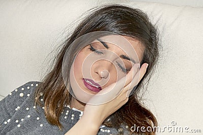Woman with headache with hands on her head Stock Photo