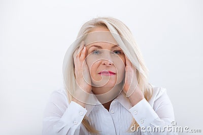 Woman Headache isolated. Menopause. Middle aged woman Stock Photo