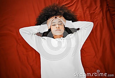 Woman with headache, mental health depression and anxiety thinking about life failure, crisis and stress on red Stock Photo