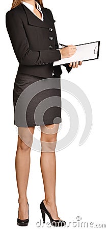 Woman headless writes ballpoint pen on a clipboard Stock Photo