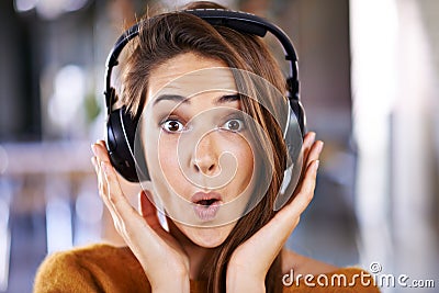 Woman, headphones and portrait for surprise or excited, relax and streaming radio for music or audio. Female person Stock Photo