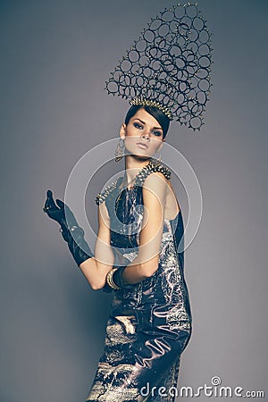 Woman in headwear with spikes Stock Photo