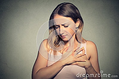 Woman with heart attack, pain, health problem Stock Photo