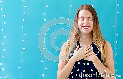 Woman with heartfelt expression Stock Photo