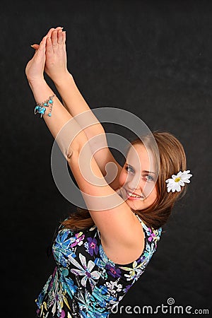 Woman with her arms raised Stock Photo