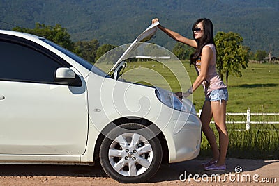 Woman with her broken car Stock Photo