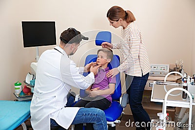 Woman with her child visiting otolaryngologist Stock Photo