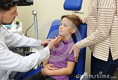 Woman with her child visiting otolaryngologist Stock Photo