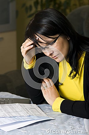 Woman and her monthly bills Stock Photo