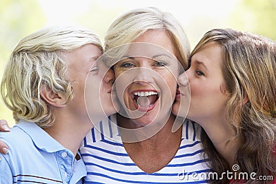 Woman And Her Teenage Children Stock Photo