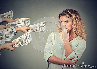 Woman hesitant to take bribe from people Stock Photo