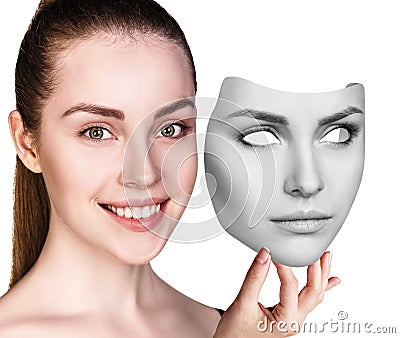 Woman hiding hapyiness under the serious mask Stock Photo