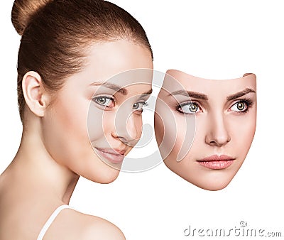 Woman hiding hapyiness under the serious mask Stock Photo