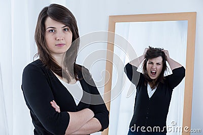 Woman hiding her emotions Stock Photo