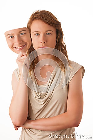 Woman hiding under the happy mask. Stock Photo