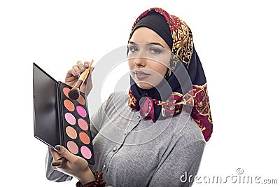 Woman in Hijab as a Make Up Artist Stock Photo