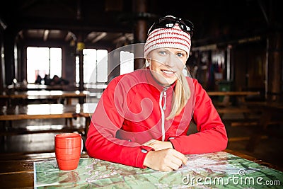 Woman hiker with map planning trip Stock Photo