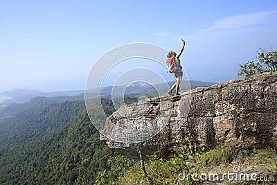 Woman hiker taking photo with cellphone Stock Photo