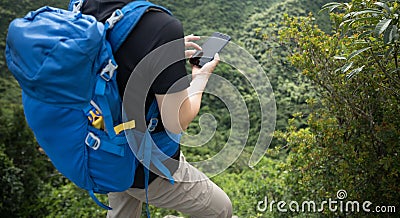 Woman hiker using smartphone Stock Photo
