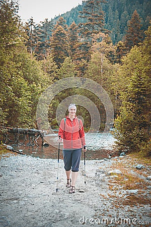 Woman hiker walking in forest outdoor. Tourism concept Stock Photo