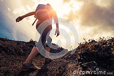 Woman hiker walks on the trail Stock Photo