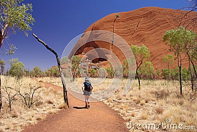 Woman Hiking Around Uluru Editorial Stock Photo