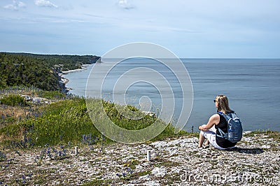 Woman hiking on the beach Stock Photo